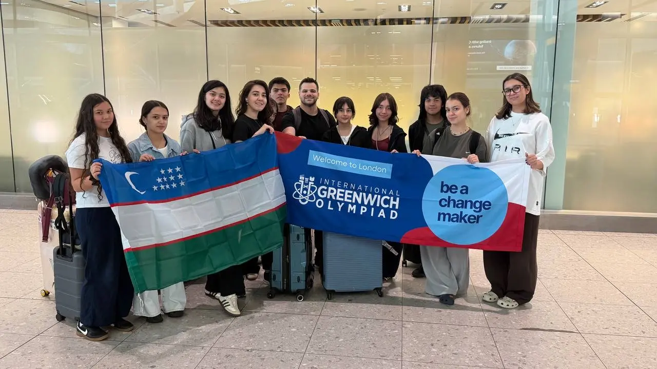 CST team arriving at the Olympiad with the flag of Uzbekistan